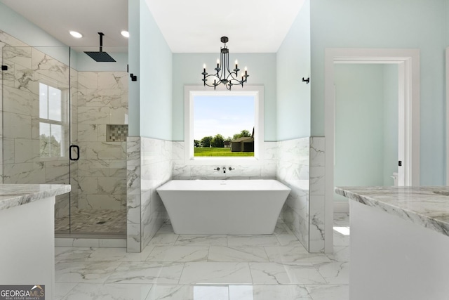 264 Community House Rd, Barnesville, GA 30204 - full bathroom featuring a marble finish shower, a freestanding tub, a chandelier, tile walls, and marble finish flooring