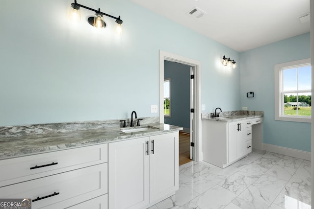 264 Community House Rd, Barnesville, GA 30204 - bathroom featuring marble look tile flooring, vanity, and baseboards