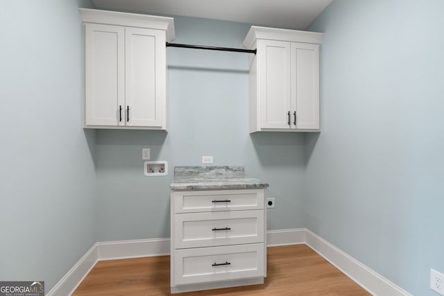 264 Community House Rd, Barnesville, GA 30204 - laundry area featuring washer hookup, cabinet space, electric dryer hookup, and light wood-style floors