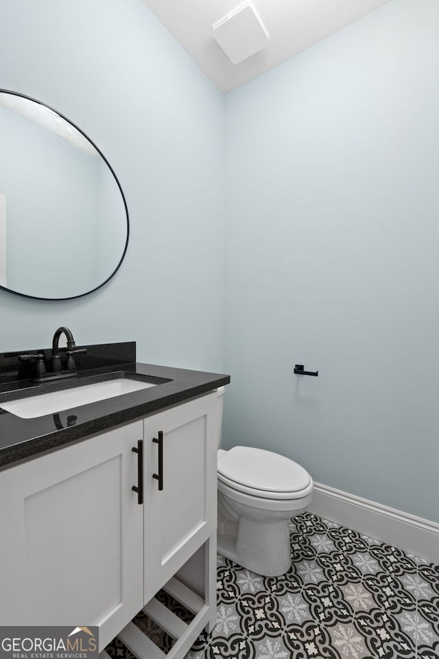 264 Community House Rd, Barnesville, GA 30204 - half bath with vanity, toilet, baseboards, and tile patterned flooring