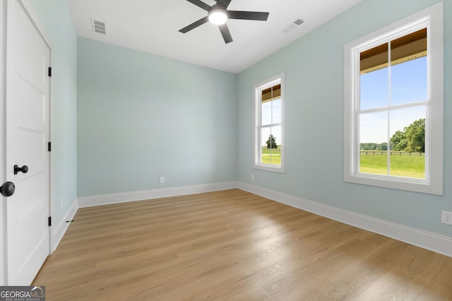 264 Community House Rd, Barnesville, GA 30204 - unfurnished room featuring ceiling fan, light wood-type flooring, healthy amount of natural light, and baseboards