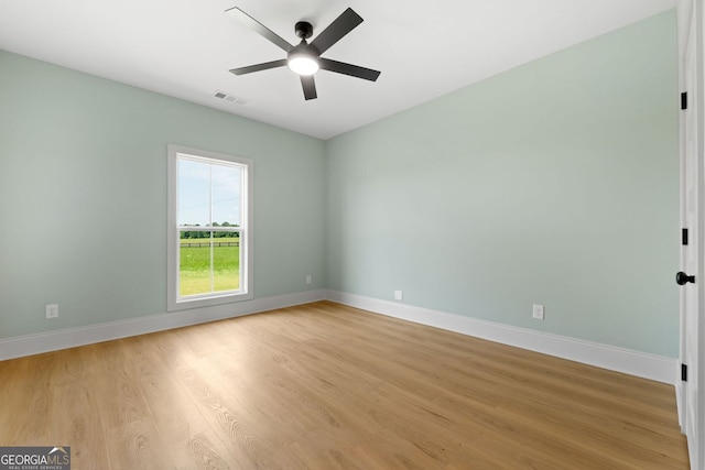 264 Community House Rd, Barnesville, GA 30204 - empty room with a ceiling fan, light wood finished floors, and baseboards