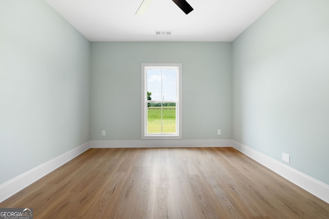 264 Community House Rd, Barnesville, GA 30204 - spare room with light wood-type flooring, a ceiling fan, and baseboards