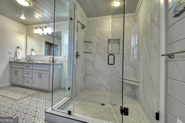 full bathroom featuring a stall shower, a sink, crown molding, and double vanity