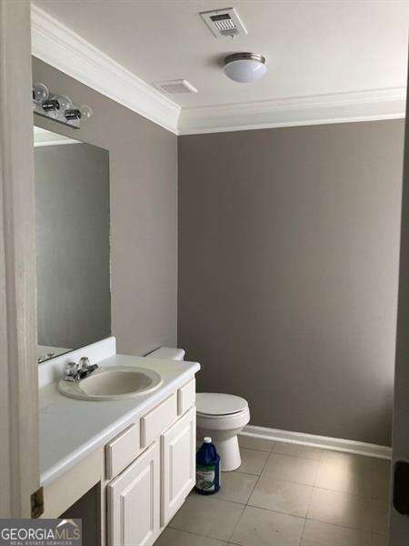 4528 Baker Grove Rd NW, Acworth, GA 30101 - bathroom with ornamental molding, vanity, and tile patterned flooring
