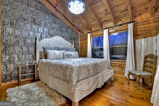 bedroom with wood ceiling, wood walls, wood finished floors, vaulted ceiling with beams, and a notable chandelier