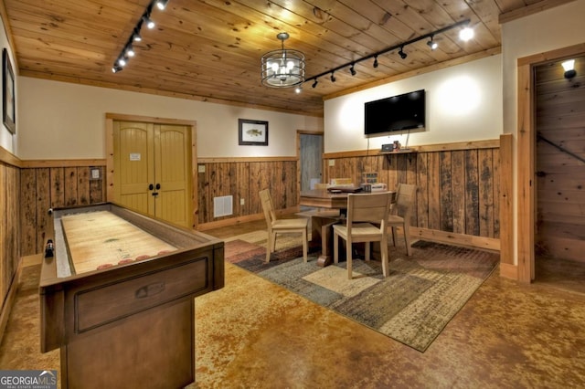 game room featuring a wainscoted wall, wood ceiling, and wooden walls
