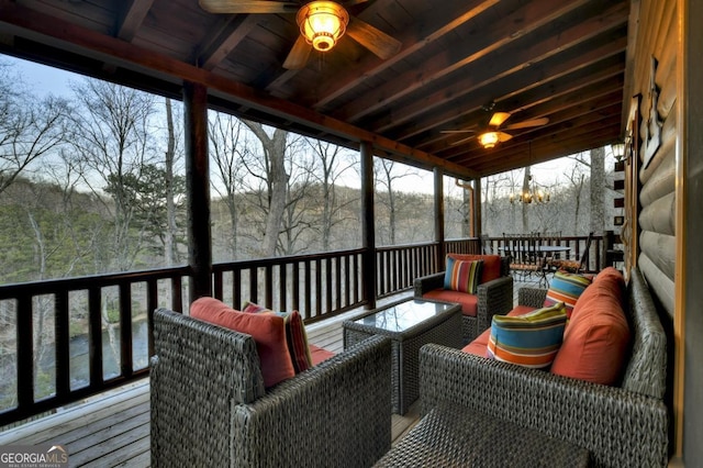 wooden deck with an outdoor hangout area and a ceiling fan