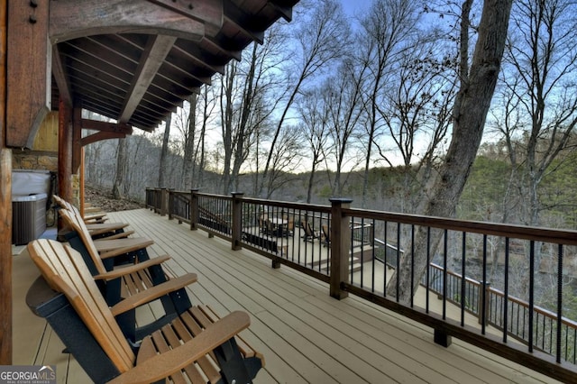 wooden terrace featuring central AC unit