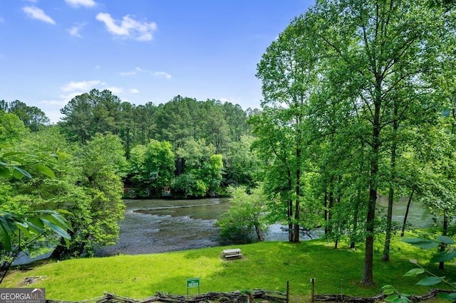 view of water feature featuring a wooded view