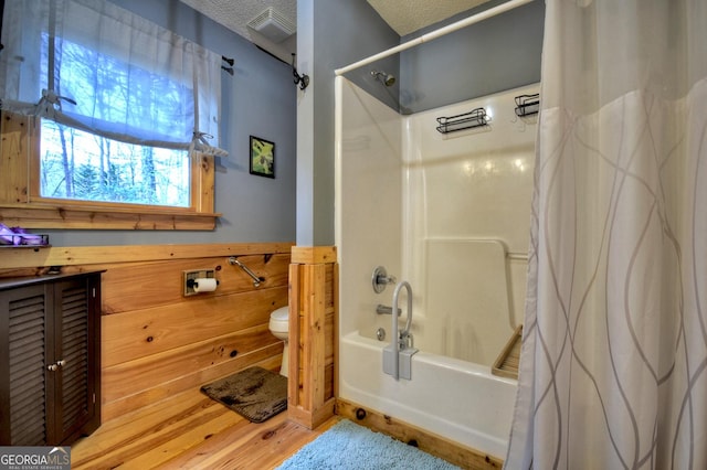 1301 Newport Dr, Ellijay, GA 30540 - full bathroom with toilet, shower / bath combo, a textured ceiling, and wood finished floors