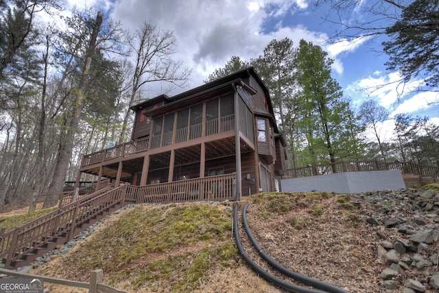 1301 Newport Dr, Ellijay, GA 30540 - rear view of house featuring stairway, a sunroom, and a deck