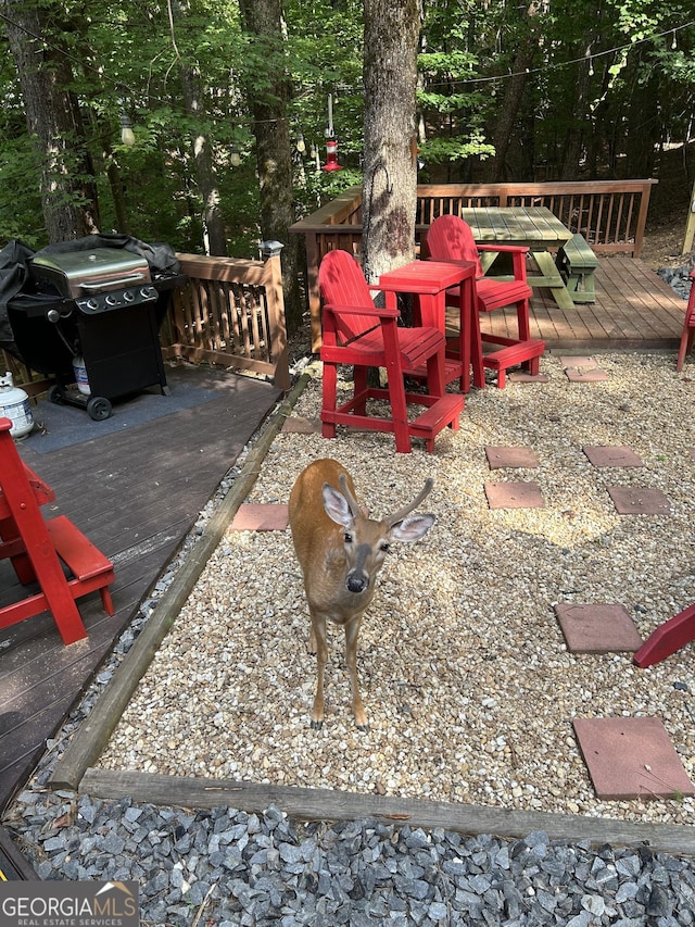 1301 Newport Dr, Ellijay, GA 30540 - wooden deck featuring a grill and outdoor dining area