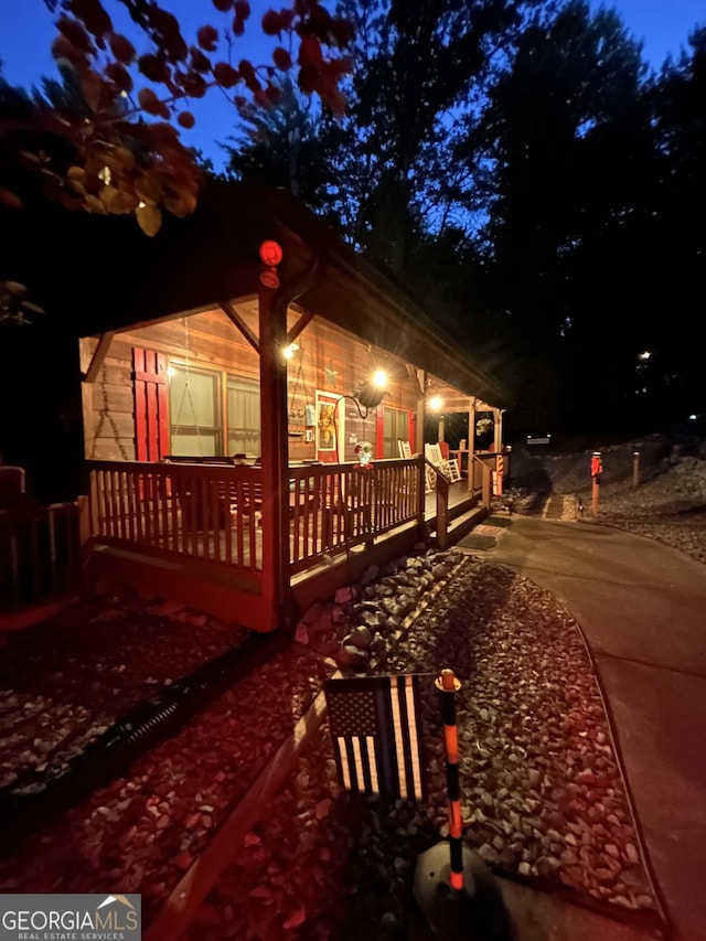 1301 Newport Dr, Ellijay, GA 30540 - property exterior at night featuring a porch