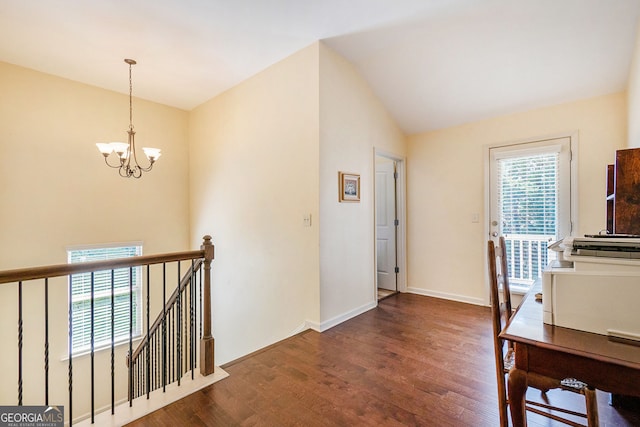 307 Montgomery Way, Woodstock, GA 30188 - hallway featuring an upstairs landing, a chandelier, wood finished floors, vaulted ceiling, and baseboards