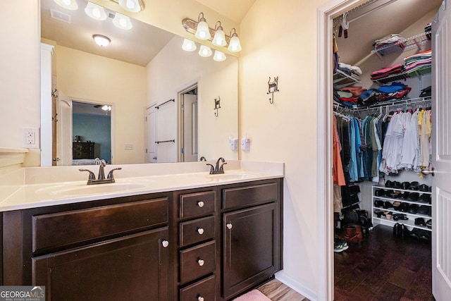 307 Montgomery Way, Woodstock, GA 30188 - bathroom featuring double vanity and a spacious closet