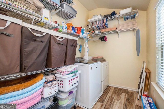 307 Montgomery Way, Woodstock, GA 30188 - washroom with wood finished floors, washer and clothes dryer, healthy amount of natural light, and baseboards
