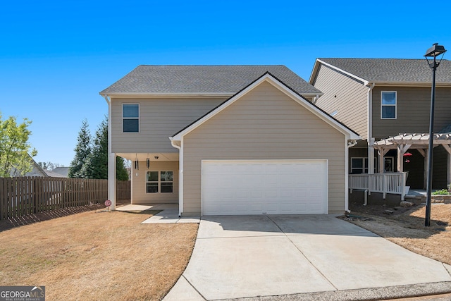 307 Montgomery Way, Woodstock, GA 30188 - view of front of home with driveway, fence, an attached garage, and a pergola