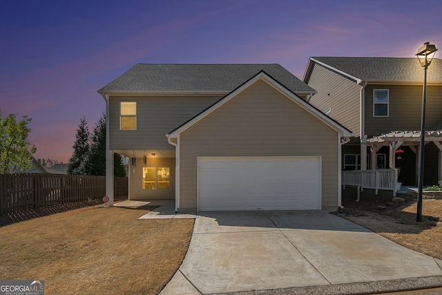 307 Montgomery Way, Woodstock, GA 30188 - view of front of home with a garage, fence, driveway, and a pergola