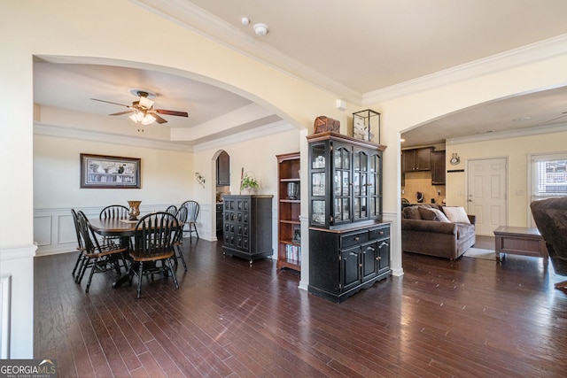 307 Montgomery Way, Woodstock, GA 30188 - dining area featuring a ceiling fan, arched walkways, wood-type flooring, and ornamental molding