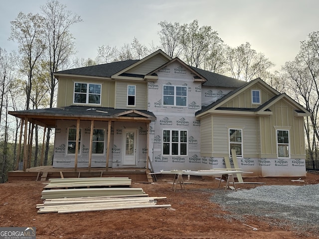 7040 Sanctuary Dr, Jefferson, GA 30549 - unfinished property featuring board and batten siding, a porch, and roof with shingles