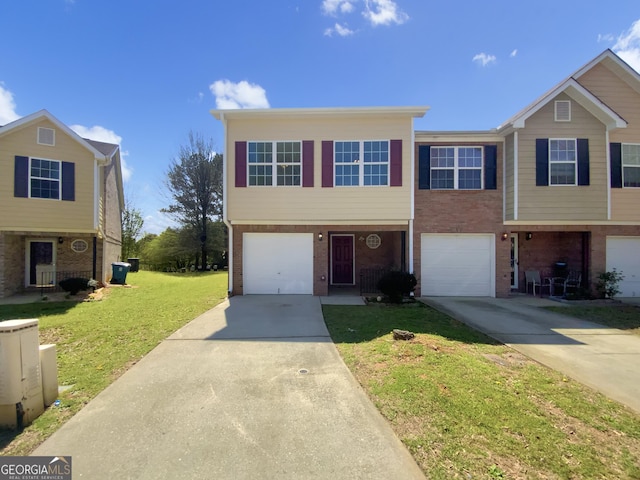 1005 Magnolia Gardens Walk, Mcdonough, GA 30253 - view of front of home with brick siding, driveway, a front lawn, and an attached garage