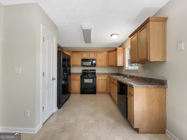 1005 Magnolia Gardens Walk, Mcdonough, GA 30253 - kitchen with baseboards, dark countertops, black appliances, and a sink