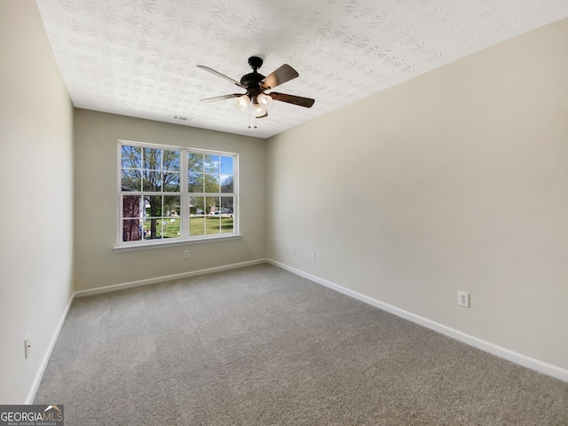 1005 Magnolia Gardens Walk, Mcdonough, GA 30253 - carpeted spare room with visible vents, a textured ceiling, baseboards, and ceiling fan