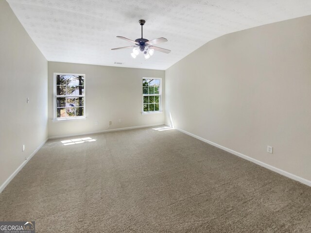 1005 Magnolia Gardens Walk, Mcdonough, GA 30253 - carpeted spare room with baseboards, lofted ceiling, visible vents, and a ceiling fan