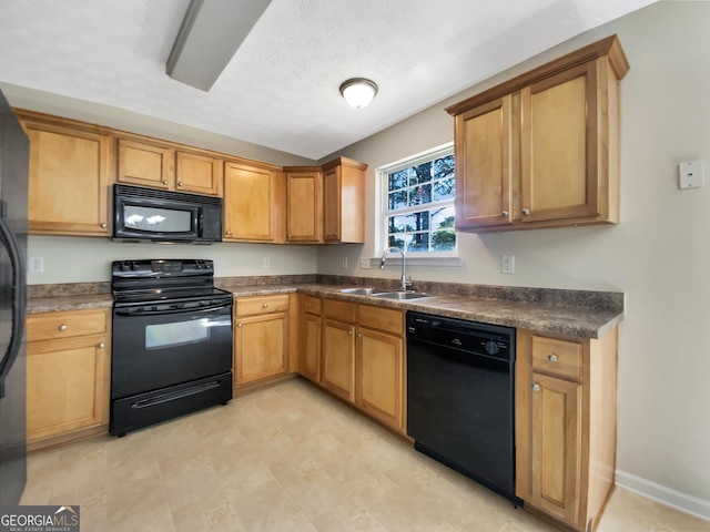1005 Magnolia Gardens Walk, Mcdonough, GA 30253 - kitchen with a sink, baseboards, black appliances, and dark countertops