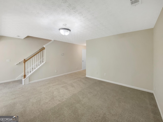 1005 Magnolia Gardens Walk, Mcdonough, GA 30253 - interior space with stairs, a textured ceiling, baseboards, visible vents, and carpet