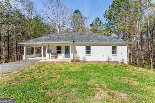 2374 Buchanan Hwy, Dallas, GA 30157 - ranch-style home with gravel driveway, a front yard, and a carport