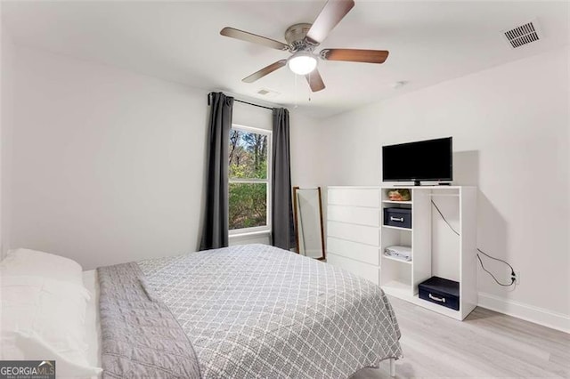 2374 Buchanan Hwy, Dallas, GA 30157 - bedroom featuring a ceiling fan, baseboards, light wood finished floors, and visible vents