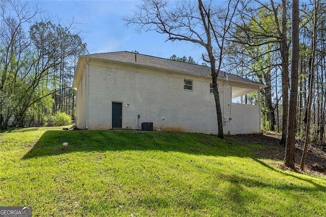 2374 Buchanan Hwy, Dallas, GA 30157 - back of house with central AC unit and a lawn