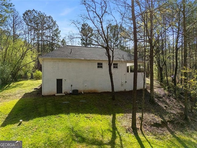 2374 Buchanan Hwy, Dallas, GA 30157 - rear view of house featuring a lawn, roof with shingles, and stucco siding