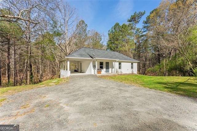 2374 Buchanan Hwy, Dallas, GA 30157 - ranch-style house featuring a front lawn, a carport, dirt driveway, and stucco siding