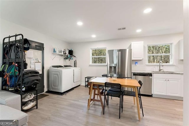 2374 Buchanan Hwy, Dallas, GA 30157 - dining space with recessed lighting, visible vents, independent washer and dryer, and light wood-style floors