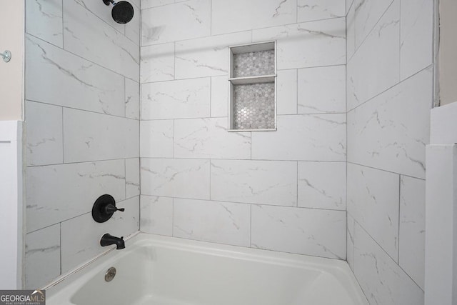 bathroom with washtub / shower combination