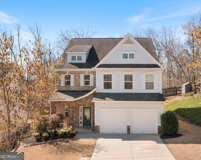 view of front facade with an attached garage, a shingled roof, concrete driveway, and stone siding