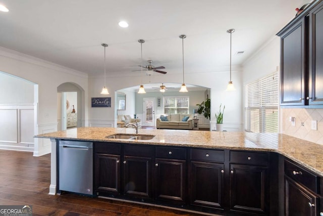 kitchen featuring arched walkways, dishwasher, a sink, ceiling fan, and dark wood-type flooring