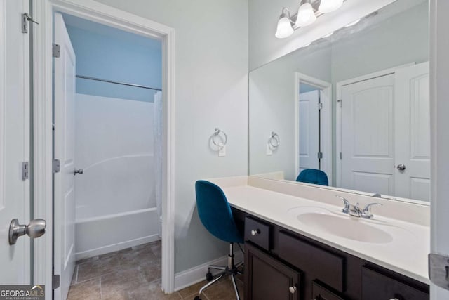 full bathroom with baseboards, shower / bathtub combination with curtain, and vanity