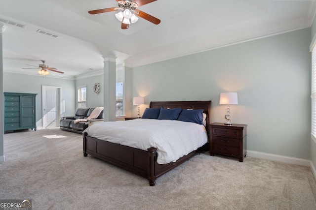 carpeted bedroom featuring visible vents, ornate columns, and ornamental molding