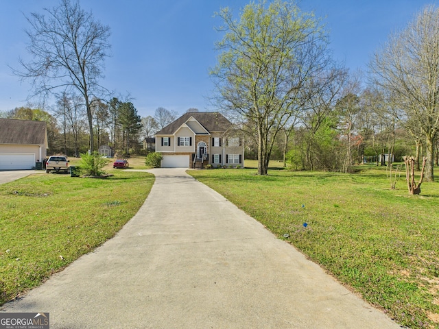 135 Grist Mill Ln SE, Calhoun, GA 30701 - view of front of home featuring a front yard, an attached garage, and concrete driveway