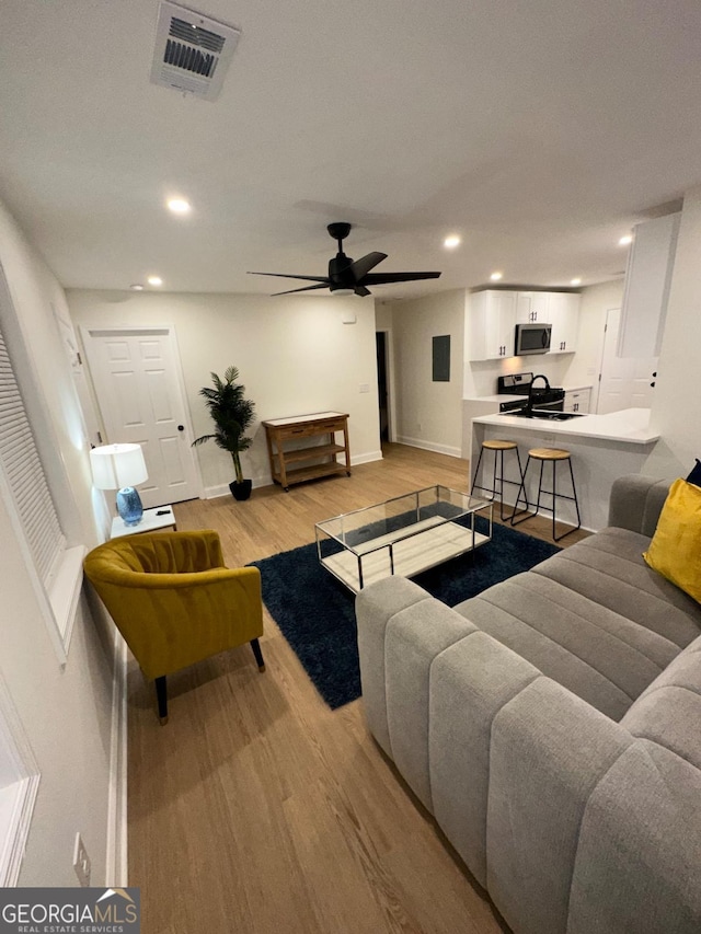 1735 Derry Ave SW, Atlanta, GA 30310 - living room with baseboards, visible vents, recessed lighting, and light wood finished floors