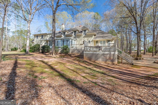 115 Flagstop Run, Fayetteville, GA 30215 - back of property with a wooden deck and a chimney