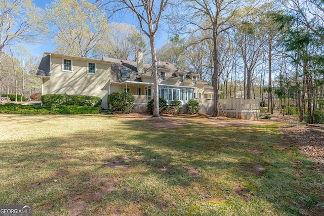 115 Flagstop Run, Fayetteville, GA 30215 - back of house with covered porch, a chimney, and stucco siding