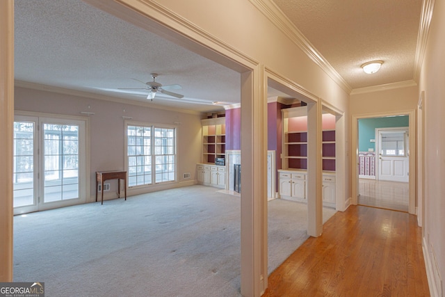 115 Flagstop Run, Fayetteville, GA 30215 - corridor featuring a textured ceiling, ornamental molding, and light carpet