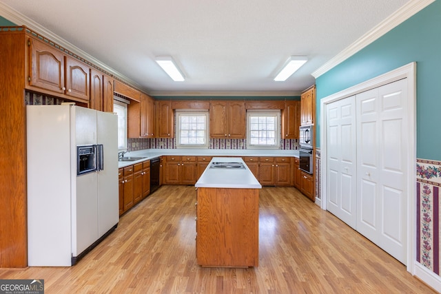 115 Flagstop Run, Fayetteville, GA 30215 - kitchen featuring white appliances, brown cabinetry, light wood-type flooring, light countertops, and crown molding