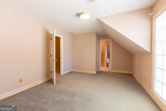 115 Flagstop Run, Fayetteville, GA 30215 - bonus room featuring carpet and vaulted ceiling