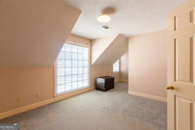 115 Flagstop Run, Fayetteville, GA 30215 - bonus room featuring a textured ceiling and carpet